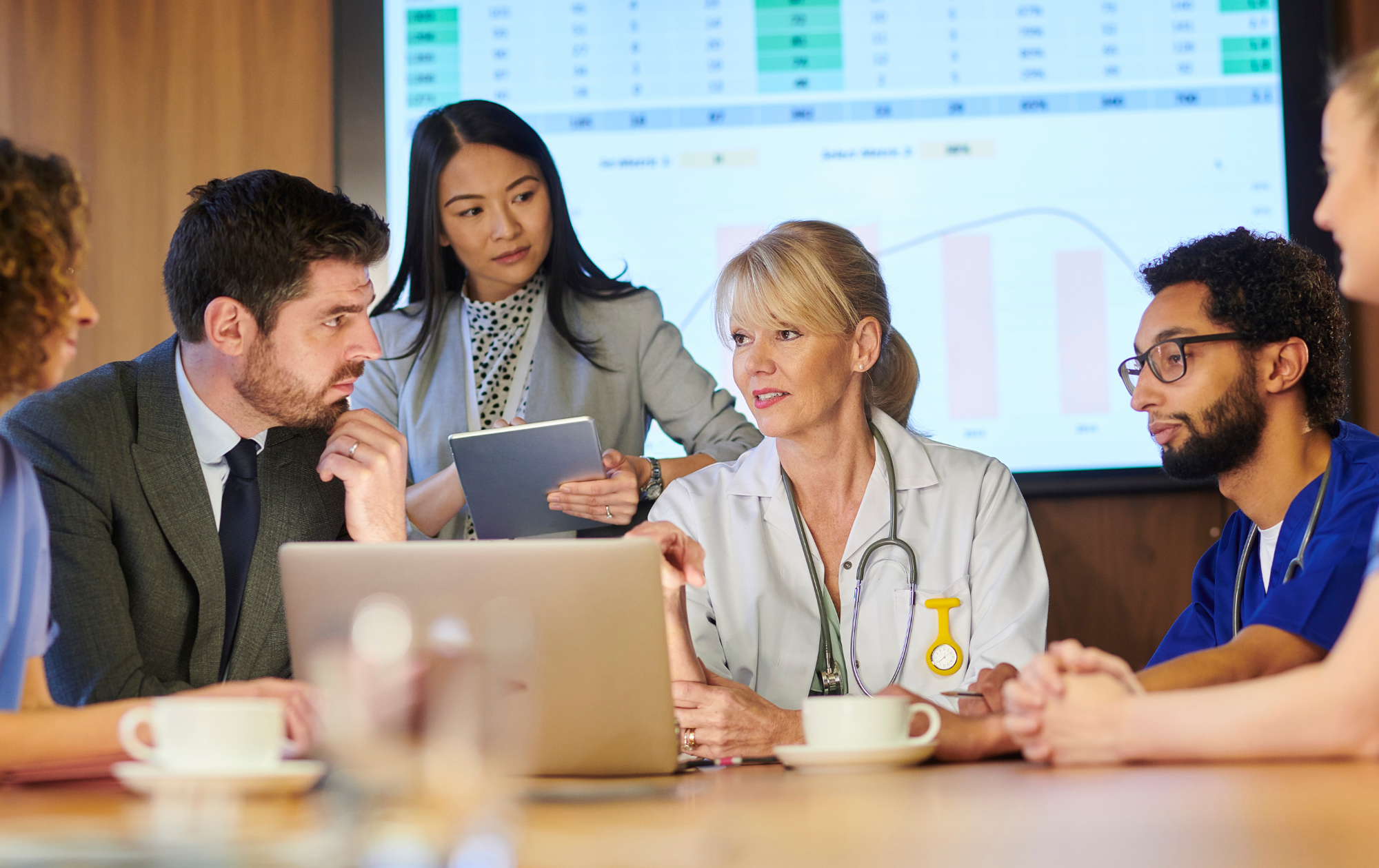 Photo of clinicians and staff talking