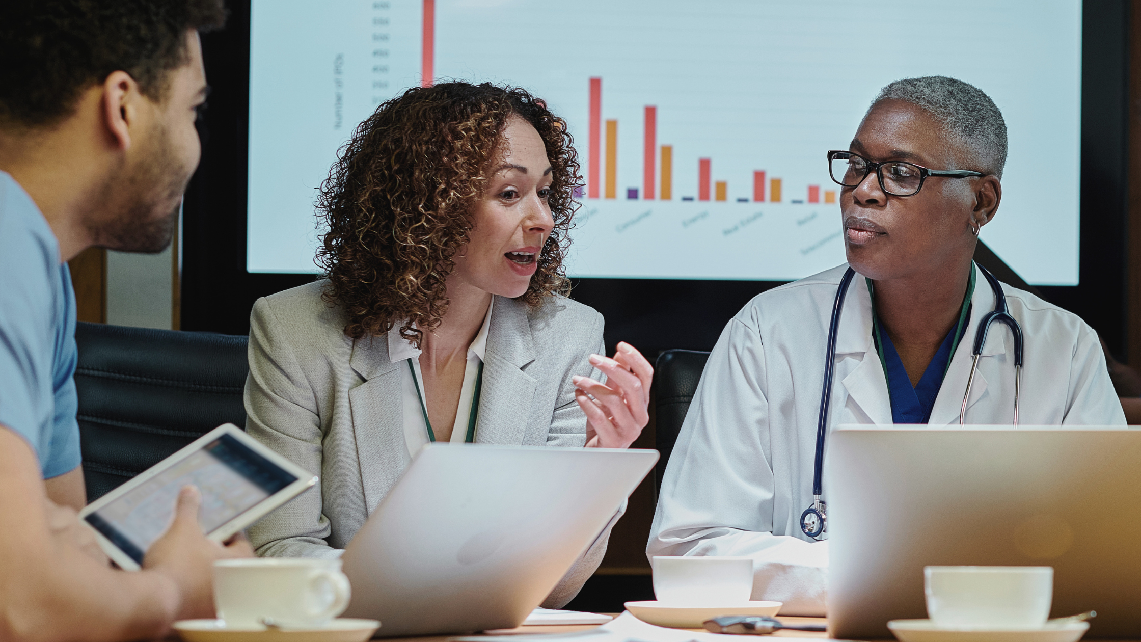 Woman meeting with colleagues