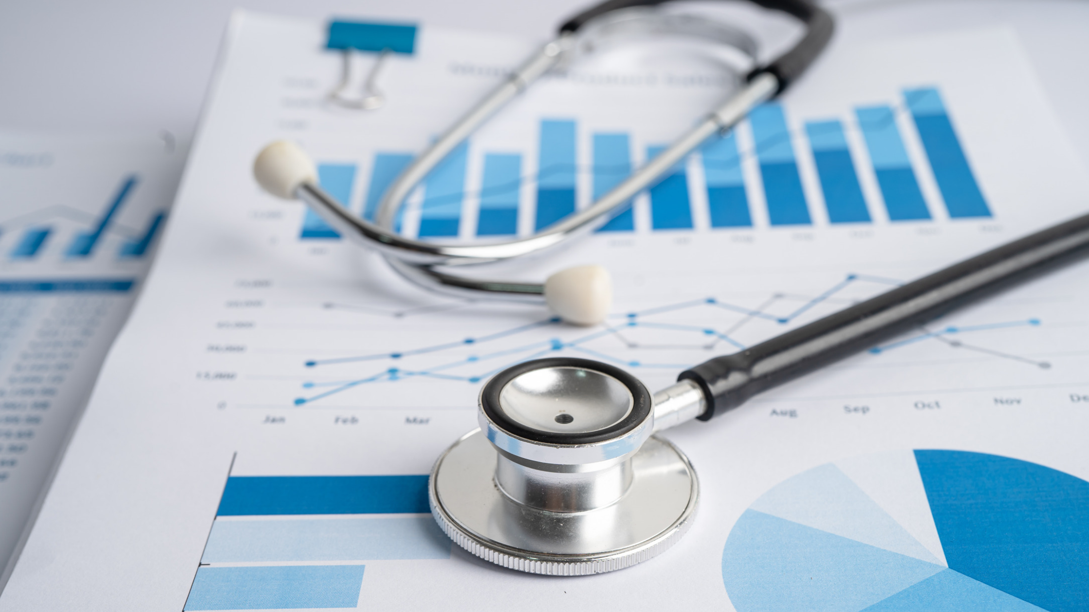 Image of stethoscope on charts