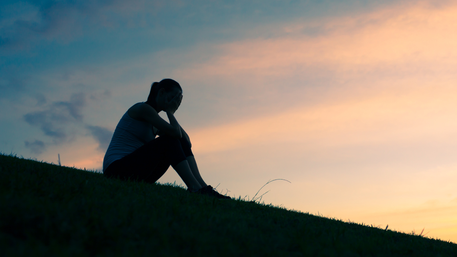 Image of person sitting outside