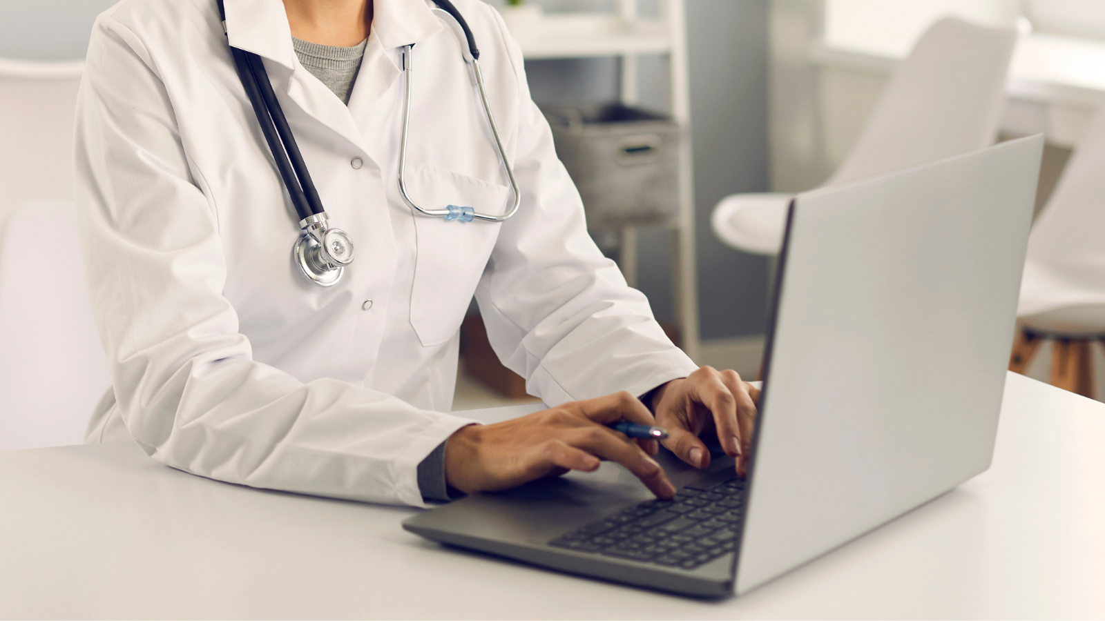 Photo of a physician typing
