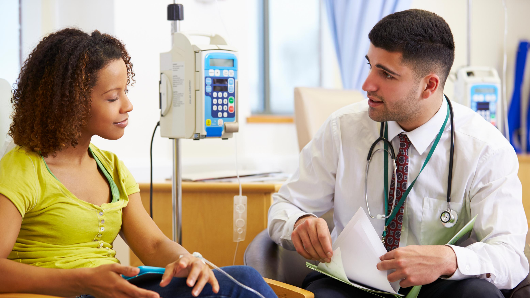 Photo of patient speaking with physician