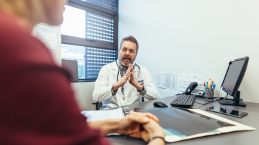 Clinician counseling a patient