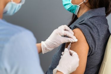 Photo of doctor giving patient a vaccine