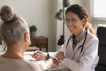 Photo of doctor talking with patient